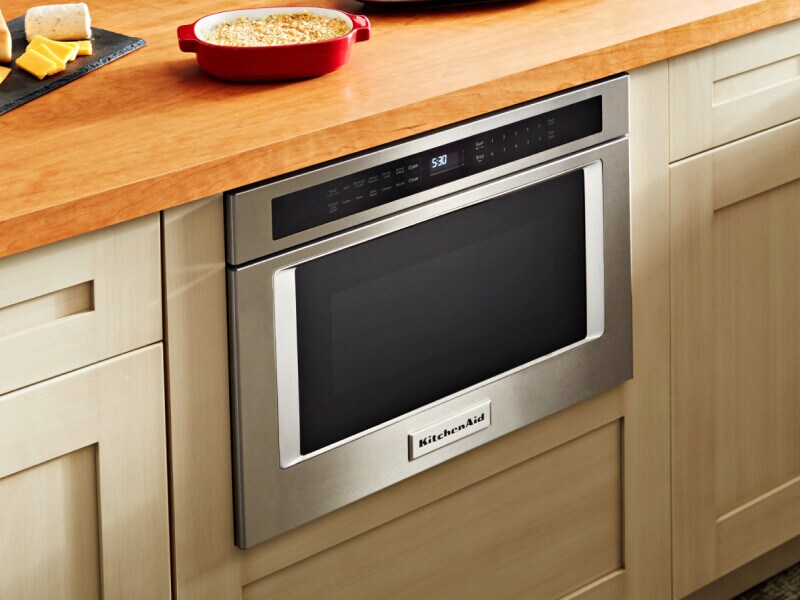  Food on a counter with a microwave drawer below