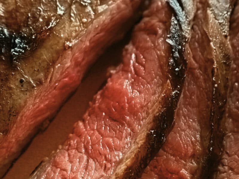 Up close image of a sliced, medium steak