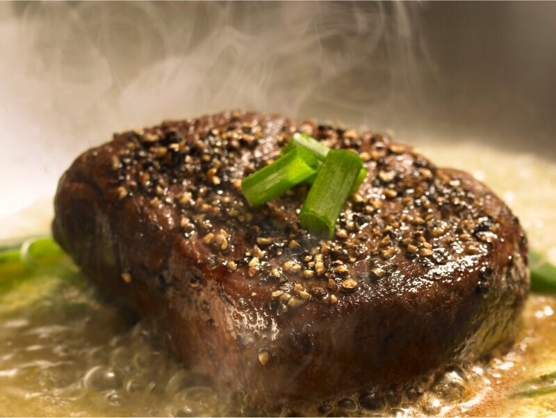 Rib cap seasoned with cracked pepper and green onions