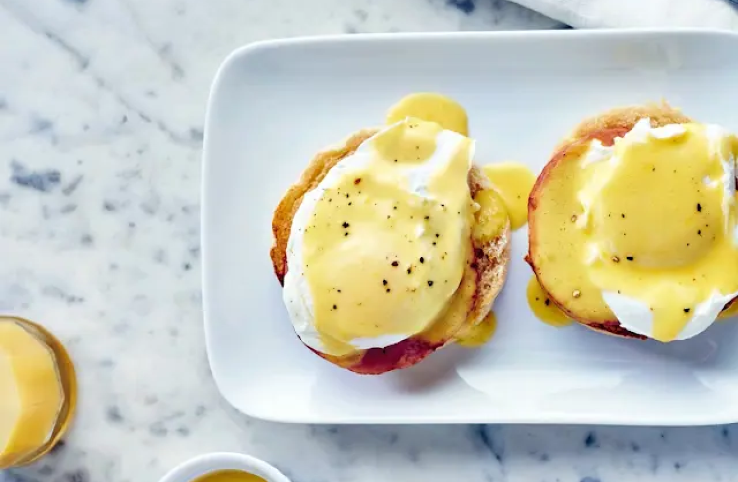 Toasted bagel with vegan eggs on a plate Toasted bagel with vegan eggs on a plate