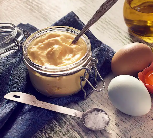 A jar of creamy vegan aioli