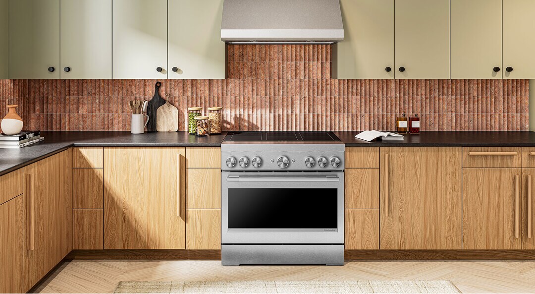 A bright kitchen with a KitchenAid® commercial-style range and light wood cabinetry