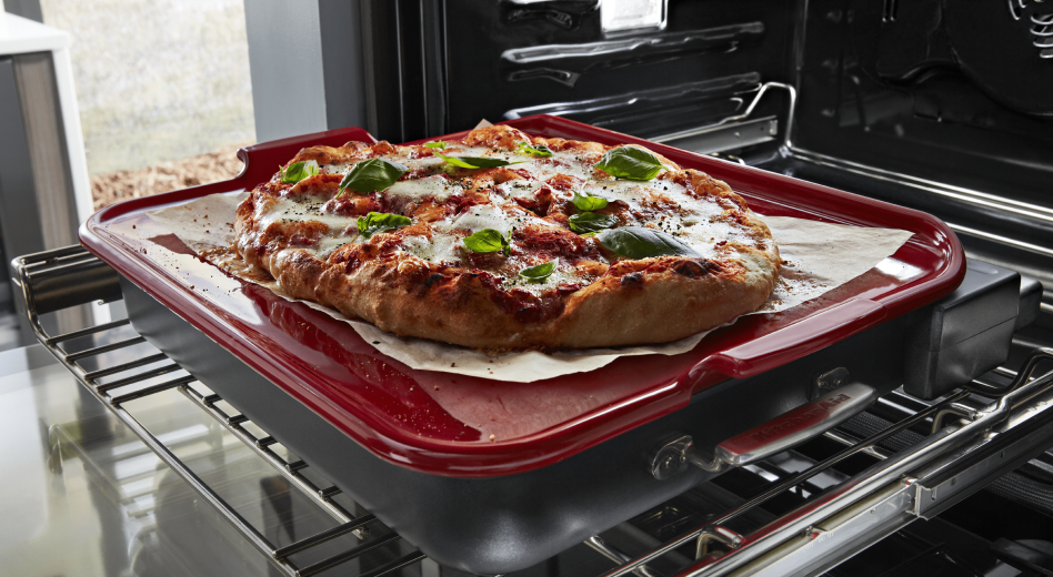 Pizza on baking stone in oven Pizza on baking stone in oven