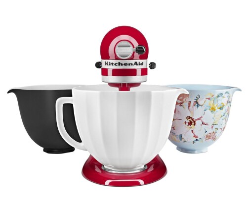Red stand mixer with three ceramic bowls that are interchangeable