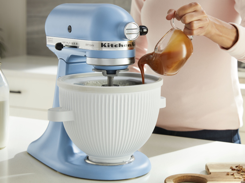 Person using ice cream maker attachment