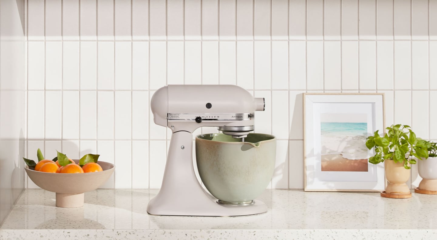 KitchenAid® stand mixer with green ceramic bowl on countertop KitchenAid® stand mixer with green ceramic bowl on countertop