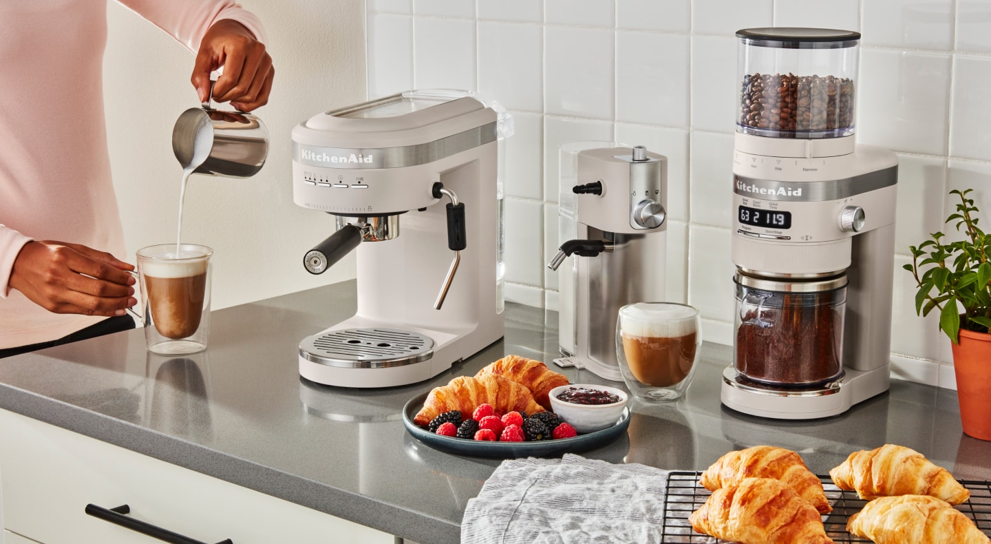 Coffee bar with a white KitchenAid® Espresso Maker, Milk Frother Attachment and Burr Grinder Coffee bar with a white KitchenAid® Espresso Maker, Milk Frother Attachment and Burr Grinder
