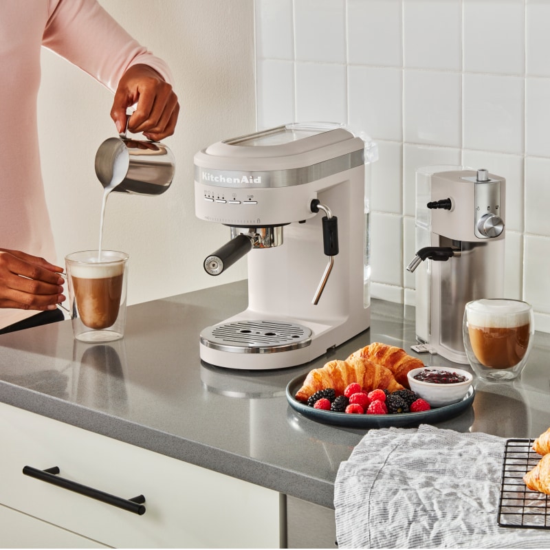 Coffee bar with a white KitchenAid® Espresso Maker, Milk Frother Attachment and Burr Grinder Coffee bar with a white KitchenAid® Espresso Maker, Milk Frother Attachment and Burr Grinder