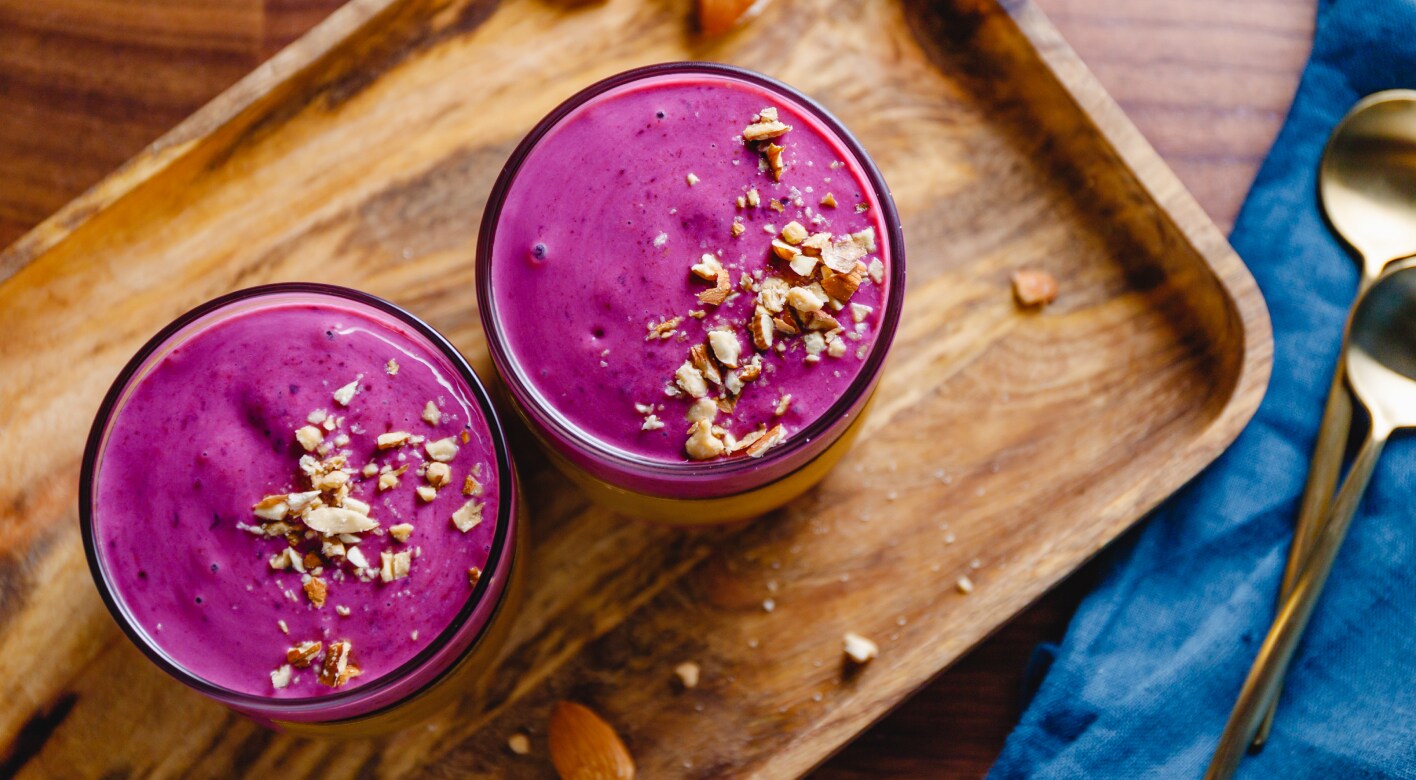 Beetroot smoothies on wooden tray Beetroot smoothies on wooden tray