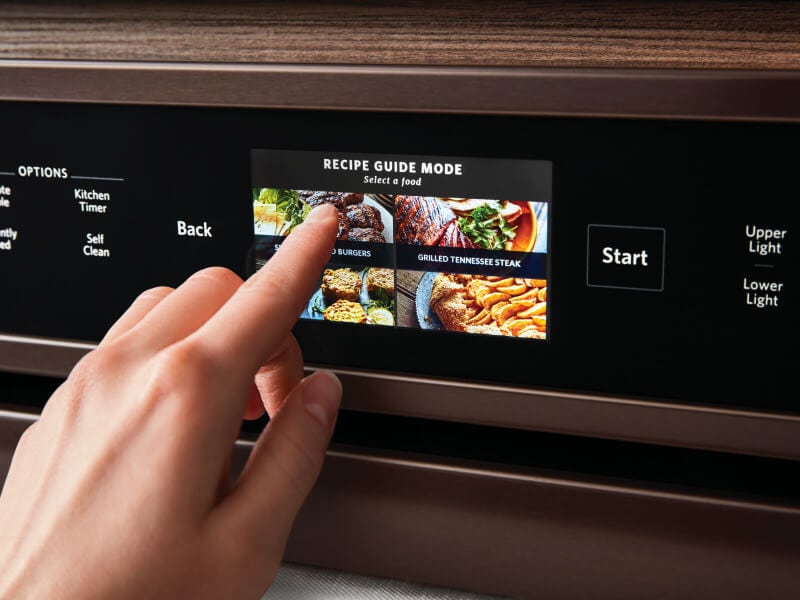 A person selecting a recipe guide mode for a convection bake setting A person selecting a recipe guide mode for a convection bake setting