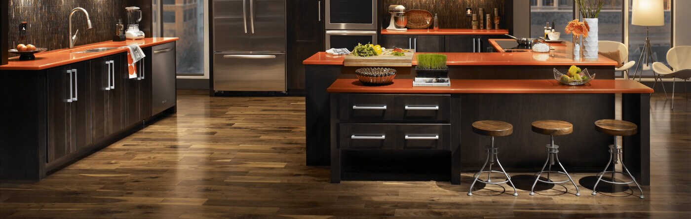 Open concept kitchen with kitchen island and counter stools