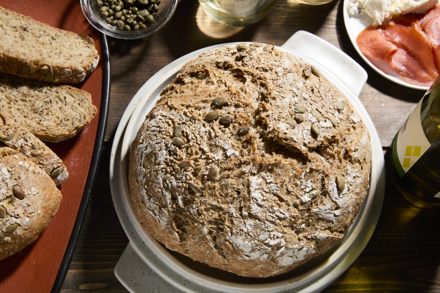 A loaf of homemade bread on a table. A loaf of homemade bread on a table.