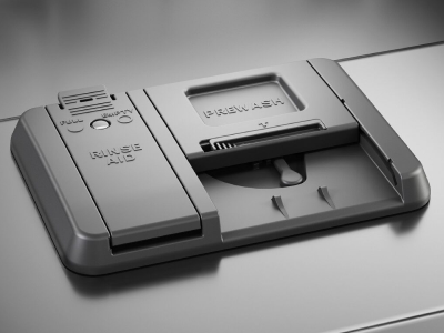 A closeup of a KitchenAid® dishwasher rinse aid dispenser.