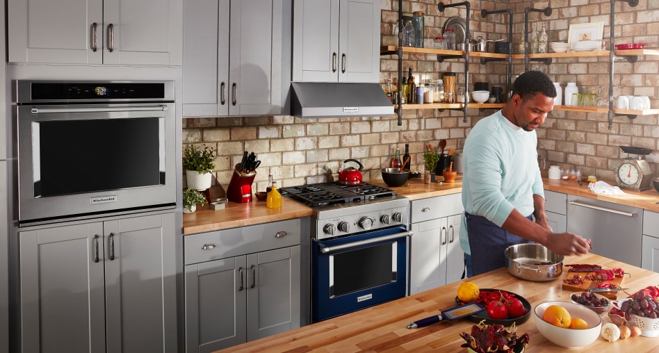KitchenAid® wall oven and commercial range in a kitchen KitchenAid® wall oven and commercial range in a kitchen