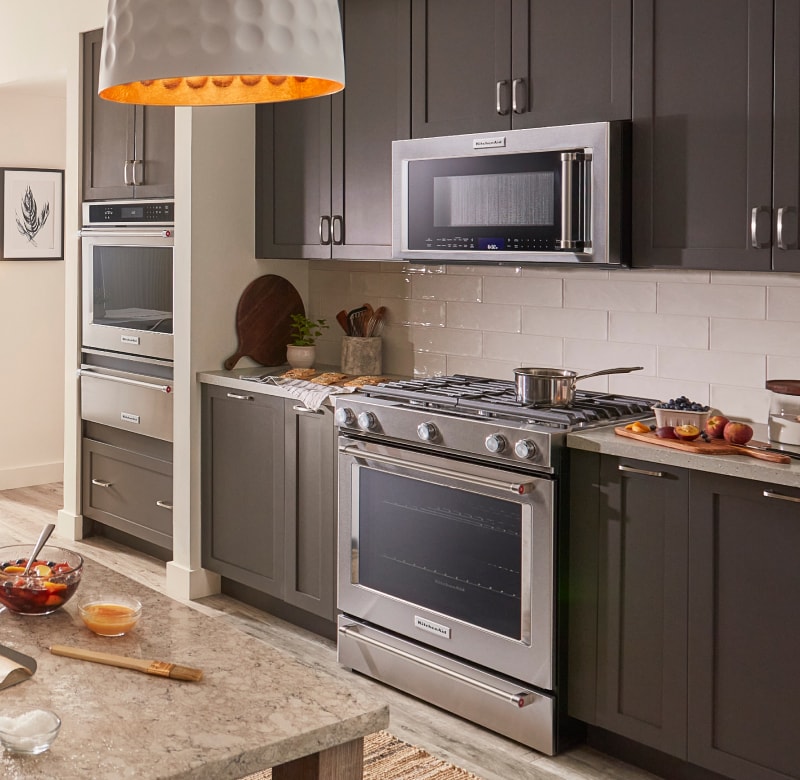 Kitchen with wall oven and range