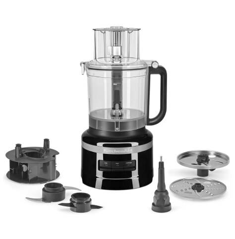 A KitchenAid® food processor surrounded by food processor parts. A KitchenAid® food processor surrounded by food processor parts.