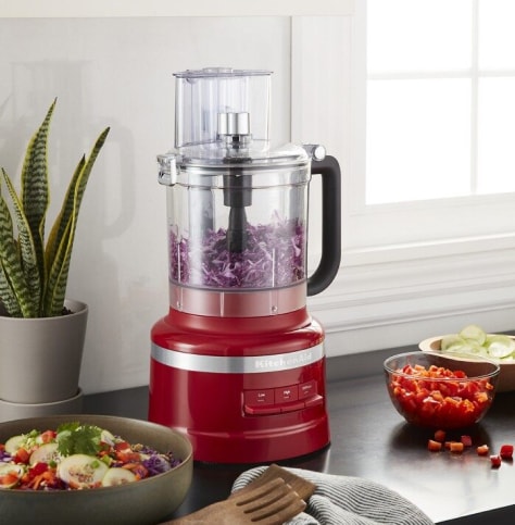 A KitchenAid® food processor chopping onions. A KitchenAid® food processor chopping onions.
