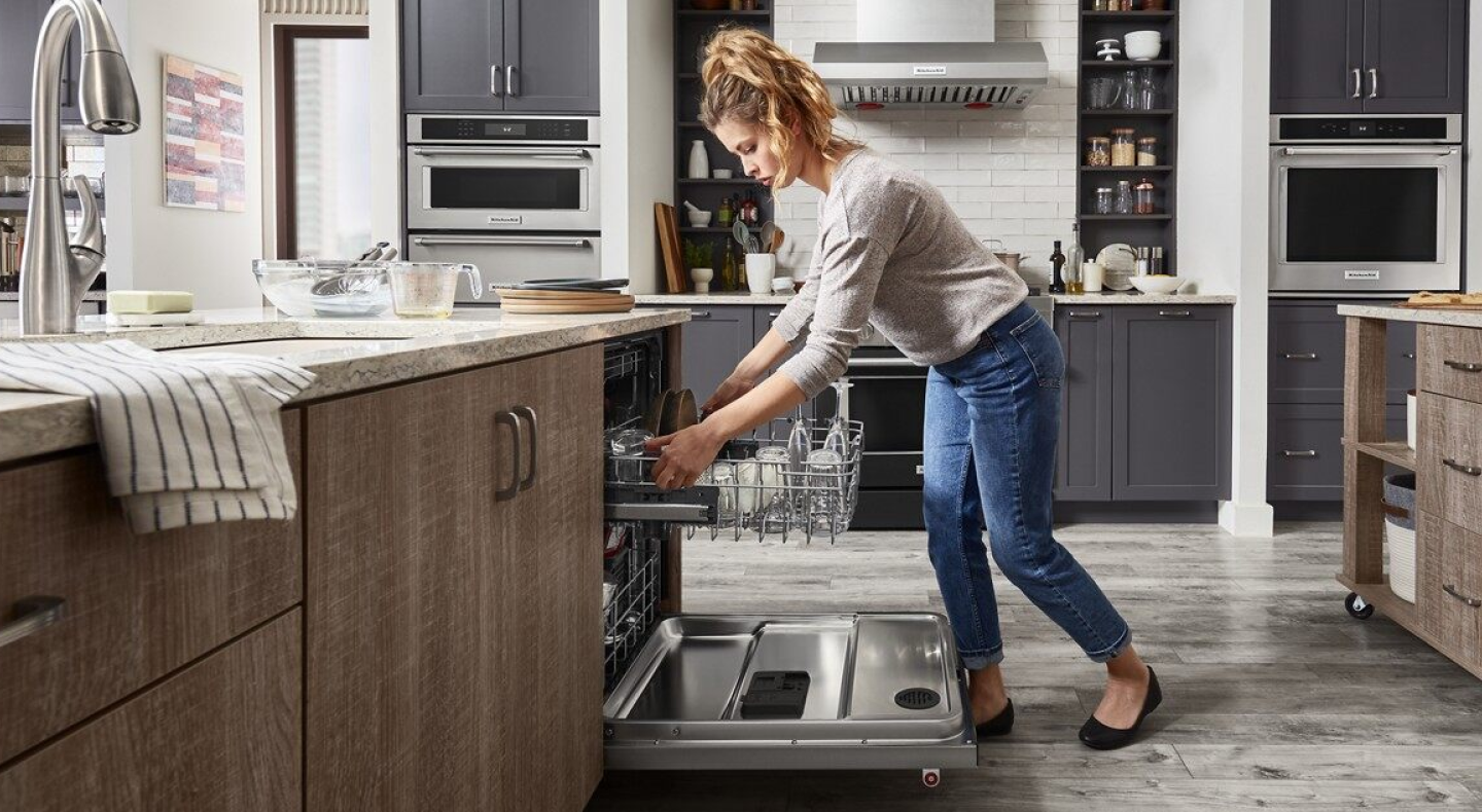 Person unloading dishwasher