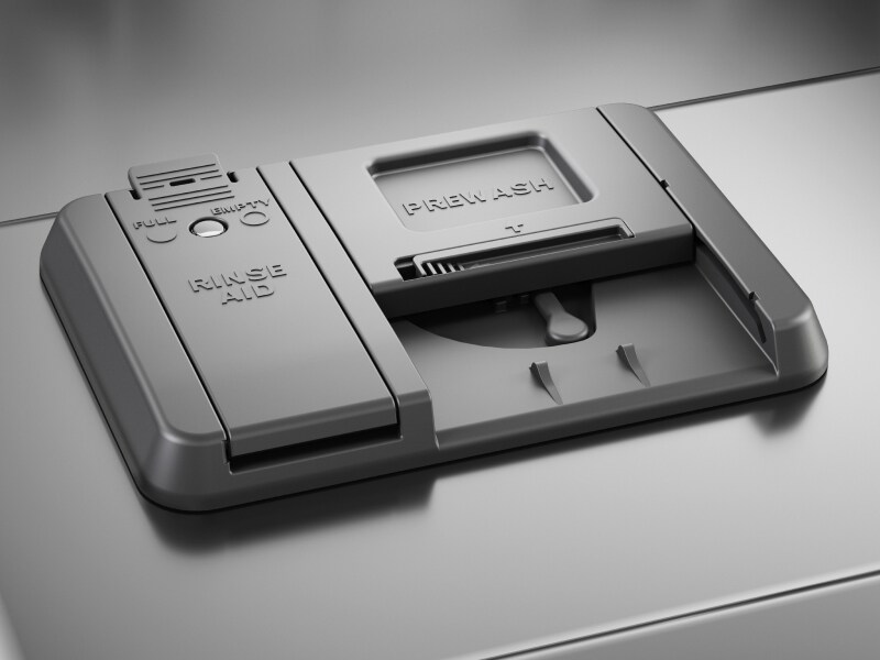 The detergent dispenser of a KitchenAid® dishwasher.