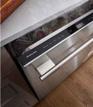 Overhead view of an open top control dishwasher