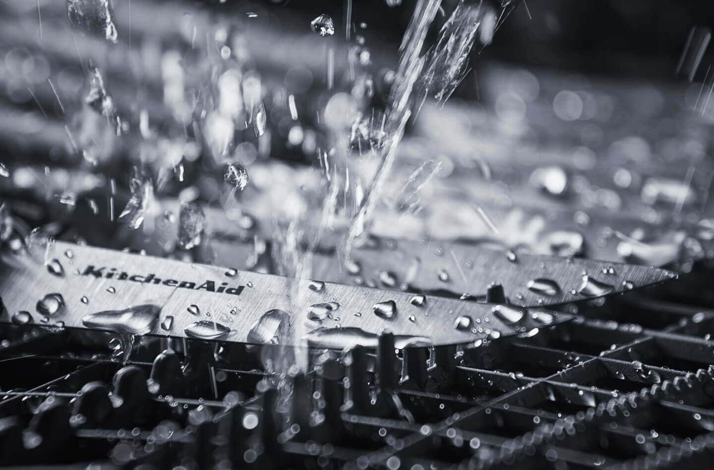 Clean water spraying knives inside of a dishwasher Clean water spraying knives inside of a dishwasher