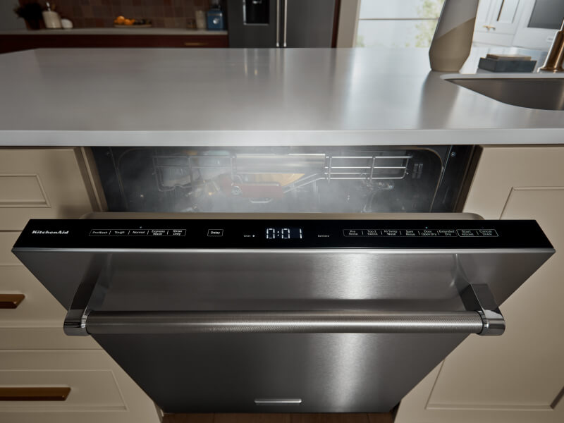 Top-control dishwasher door cracked open with steam coming out Top-control dishwasher door cracked open with steam coming out