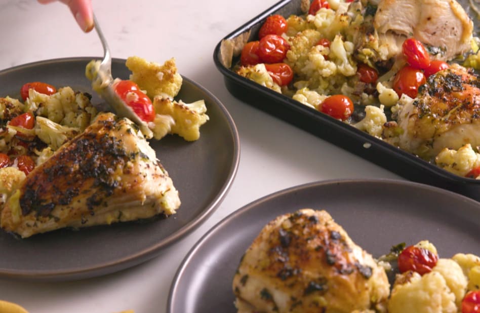 Air fried chicken breasts on a pan with side dish Air fried chicken breasts on a pan with side dish