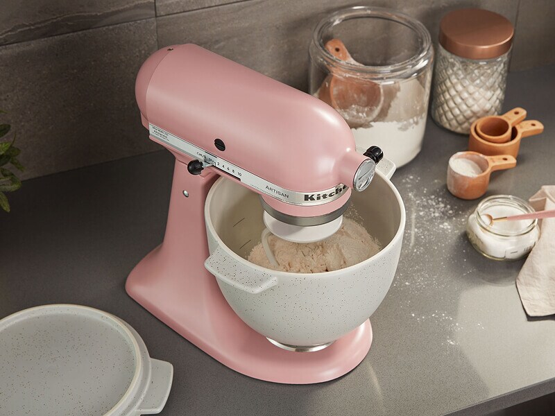 A pink KitchenAid® mixer mixing a batch of dough