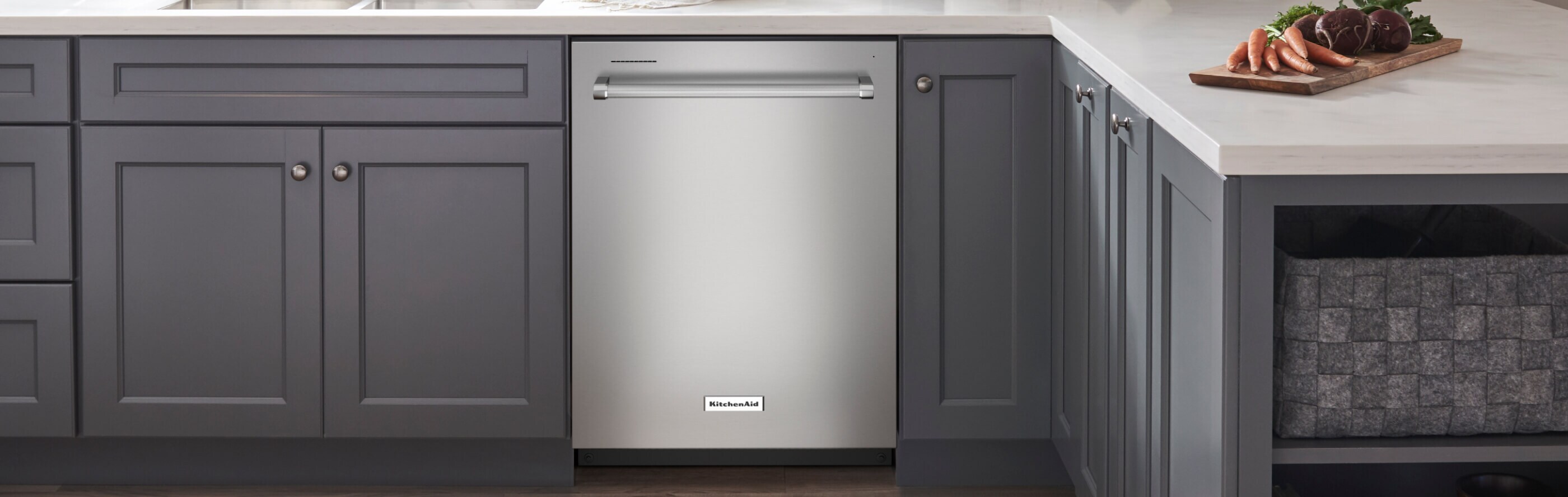 Silver KitchenAid® dishwasher in dark gray cabinetry