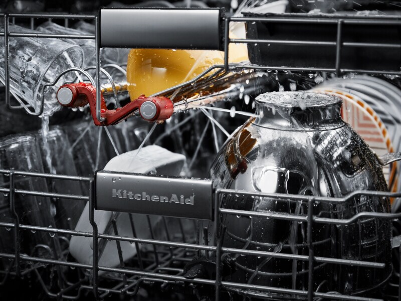 Dishes getting cleaned inside a KitchenAid® dishwasher Dishes getting cleaned inside a KitchenAid® dishwasher