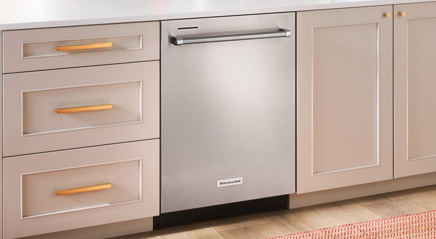 A built-in top control dishwasher with a towel bar handle