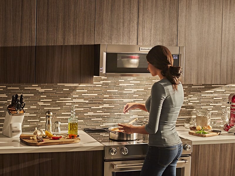 Person cooking on an electric range Person cooking on an electric range