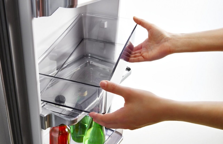 Person removing refrigerator door bin Person removing refrigerator door bin