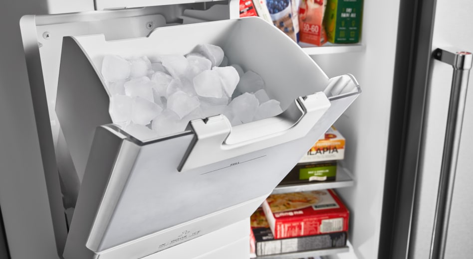 Ice maker with ice in a freezer Ice maker with ice in a freezer