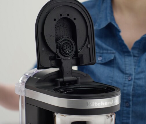 Drip coffee maker with lid open