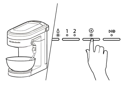 Espresso machine with bowl under group head, finger pressing clean cycle button