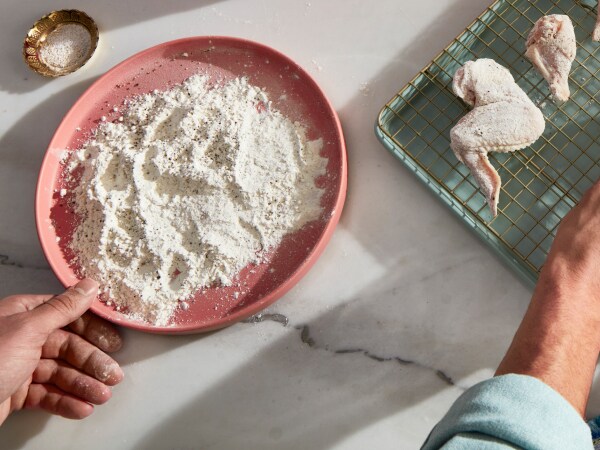Prepping food for a KitchenAid® countertop oven with air fry.