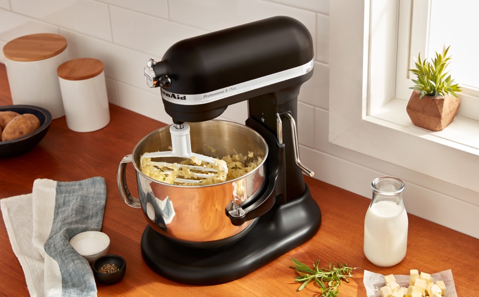 Black KitchenAid® Stand Mixer with pastry blender attachment mixing a dough Black KitchenAid® Stand Mixer with pastry blender attachment mixing a dough