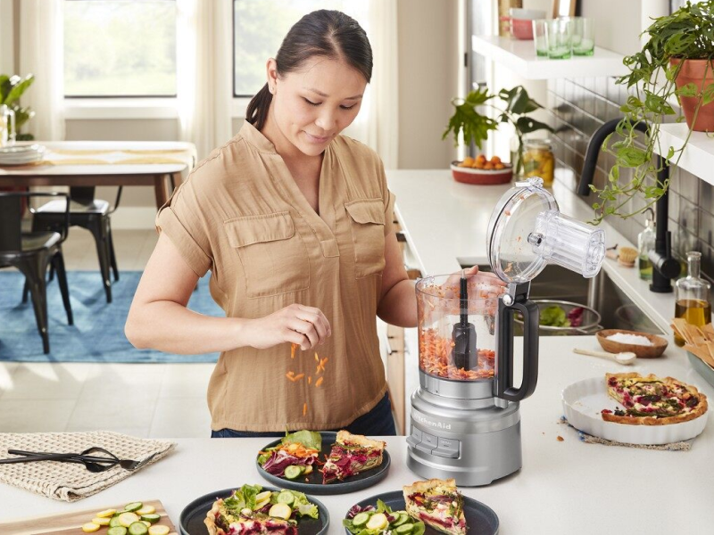 Person using KitchenAid® food processor Person using KitchenAid® food processor