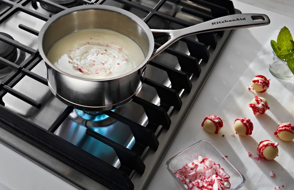 White chocolate melting on a gas cooktop White chocolate melting on a gas cooktop