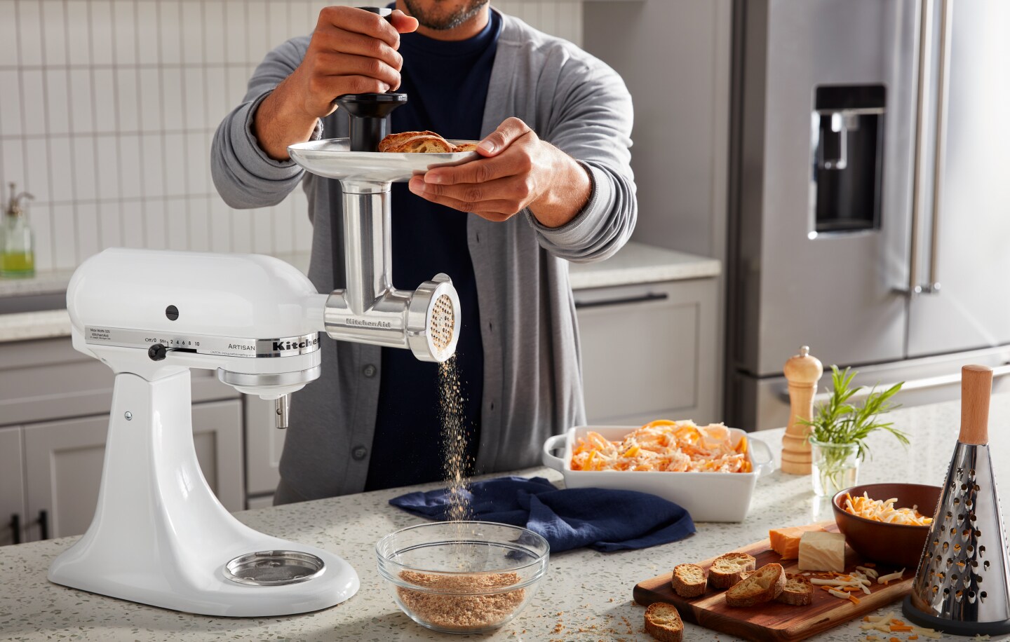 Person using food grinder attachment to make bread crumbs Person using food grinder attachment to make bread crumbs