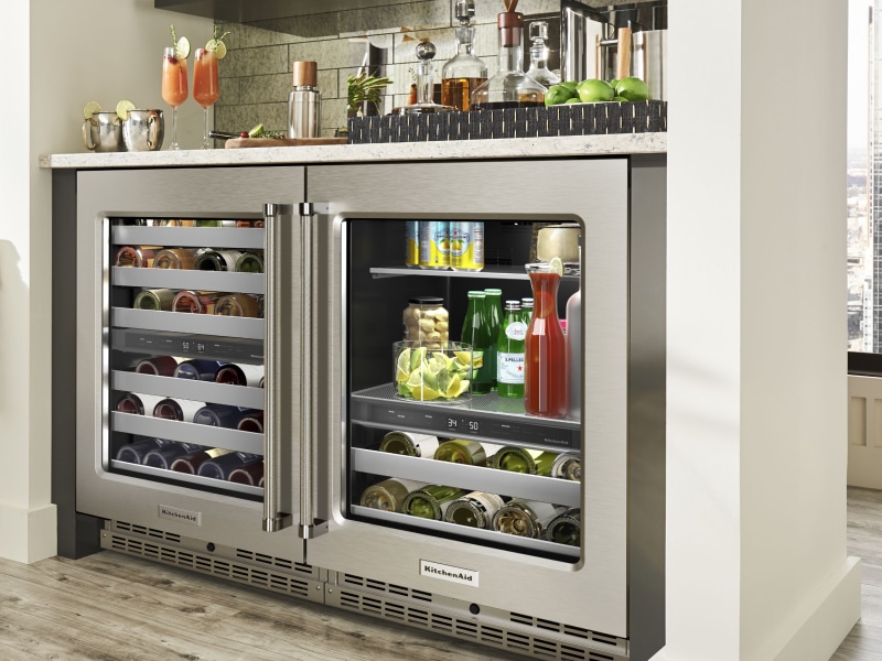 A fridge filled with drinks to pair with a charcuterie board A fridge filled with drinks to pair with a charcuterie board