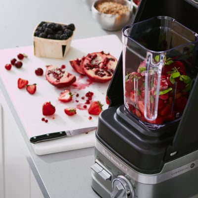 KitchenAid® blender filled with strawberries, blueberries and pomegranate seeds