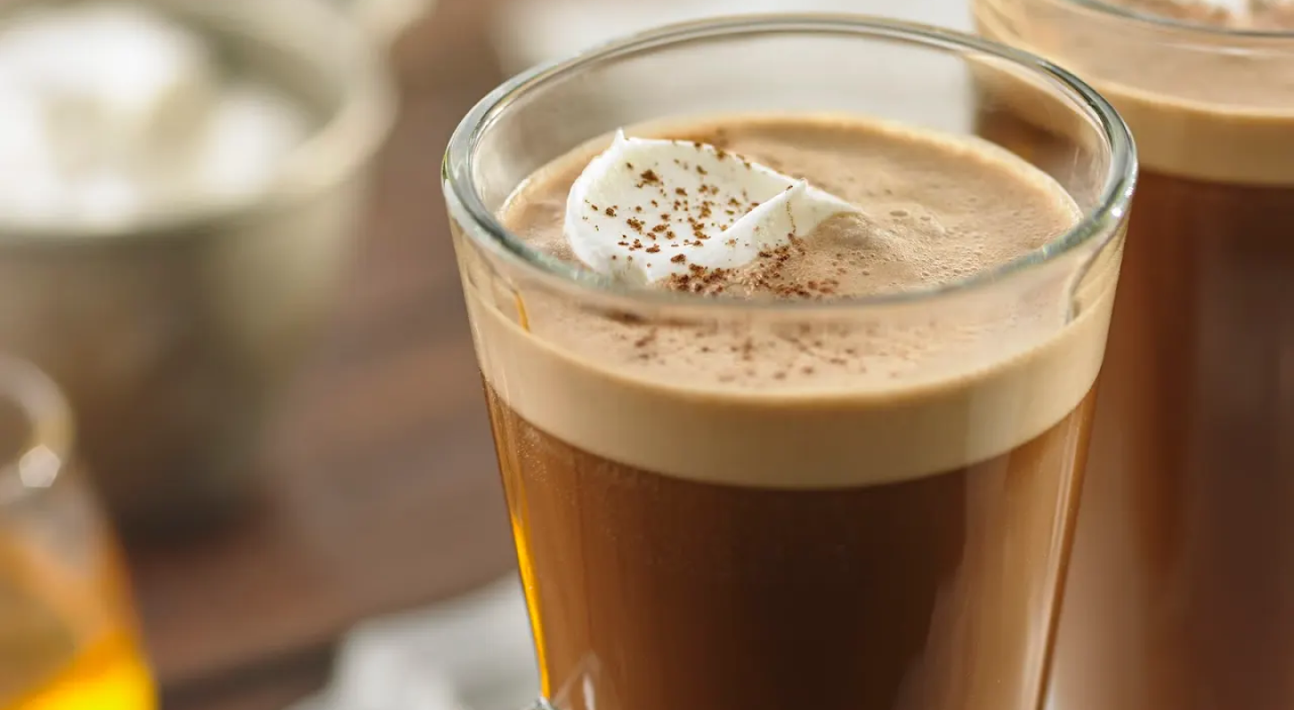 Irish coffee topped with a dollop of whipped cream Irish coffee topped with a dollop of whipped cream