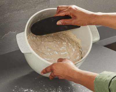 Bread dough inside a KitchenAid® Bread Bowl with Lid