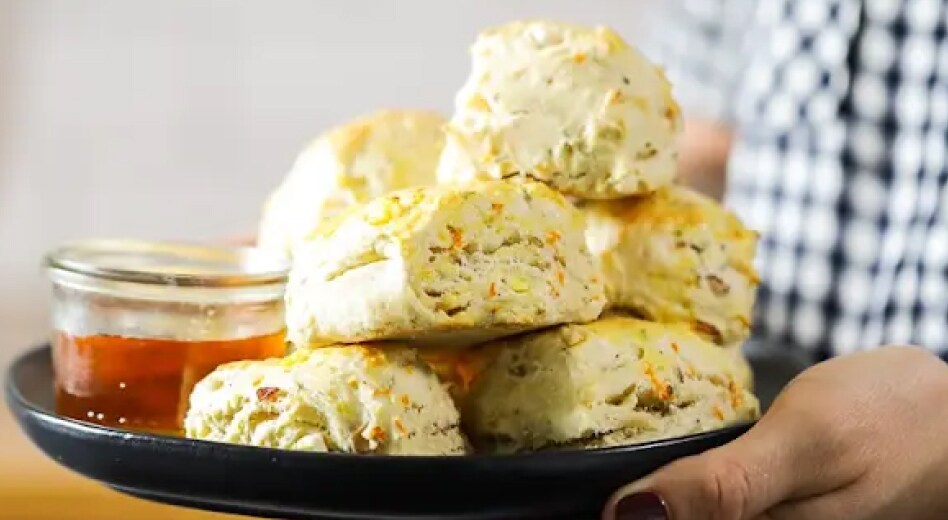 Person holding plate of homemade biscuits