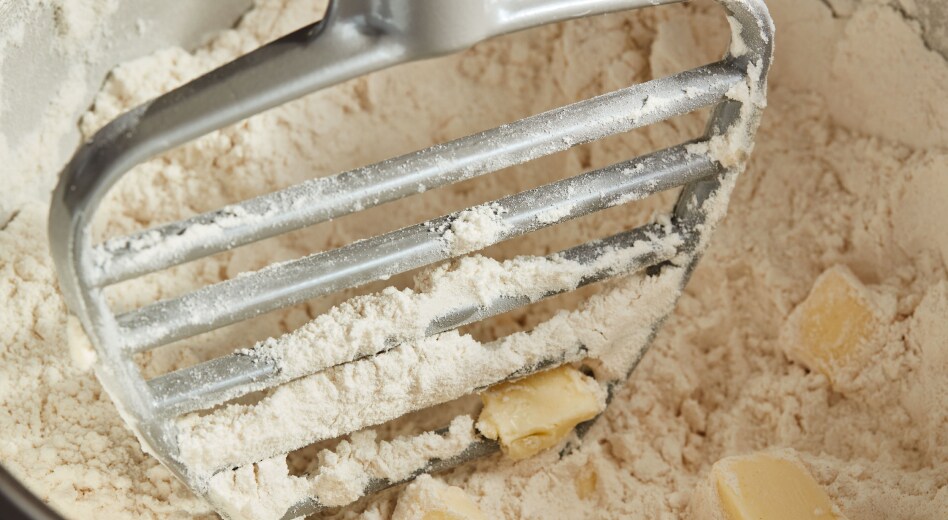 KitchenAid(R) Pastry Beater cutting butter into flour