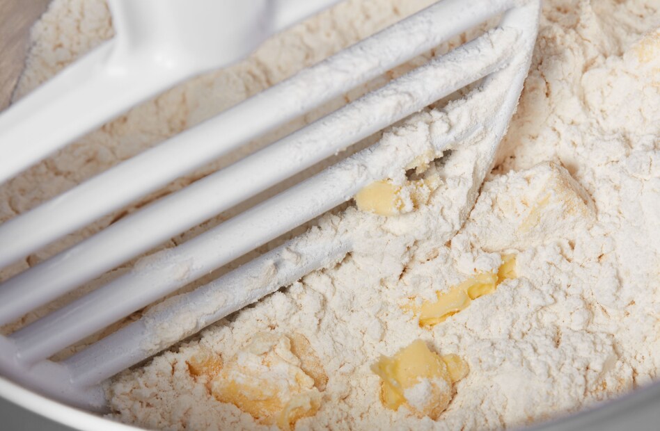 KitchenAid(R) Pastry Beater cutting butter into flour