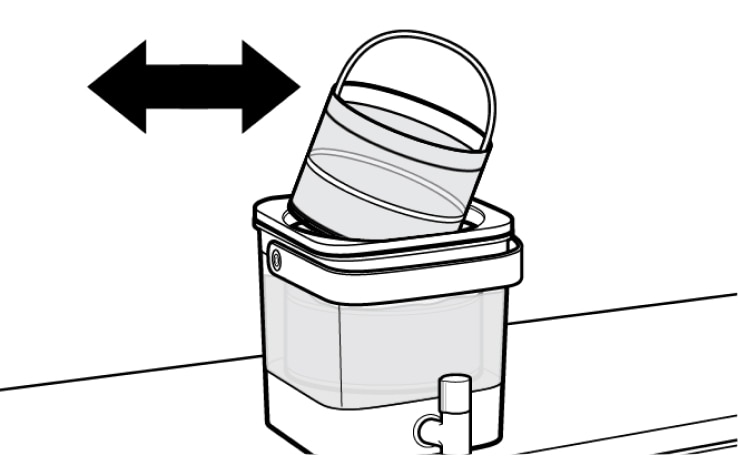 Cold brew coffee filter being removed from machine