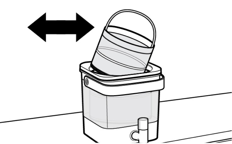 Cold brew coffee filter being removed from machine